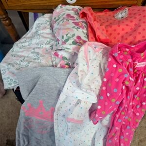 Baby girls sacks and swaddles
